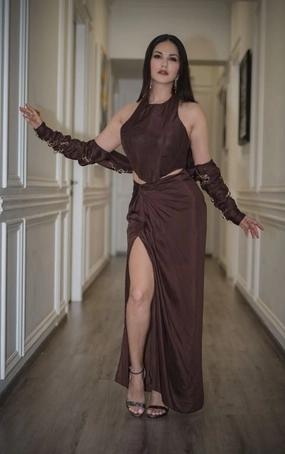 Sunny Leone in Nirmooha's Brown Corset Top with Hand Embroidered Bolero and Knotted Drape Skirt from Aham Asmi Collection.