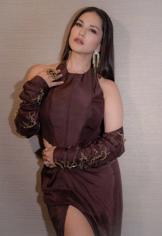 Sunny Leone in Nirmooha's Brown Corset Top with Hand Embroidered Bolero and Knotted Drape Skirt from Aham Asmi Collection.