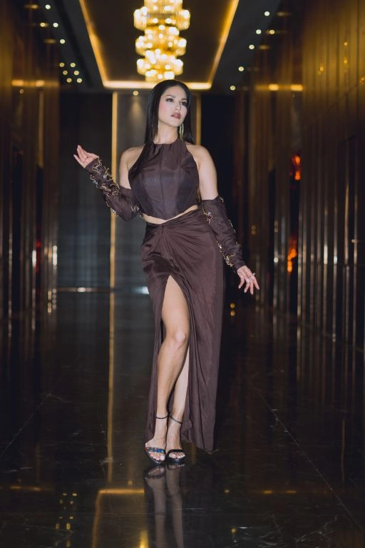 Sunny Leone in Nirmooha's Brown Corset Top with Hand Embroidered Bolero and Knotted Drape Skirt from Aham Asmi Collection.