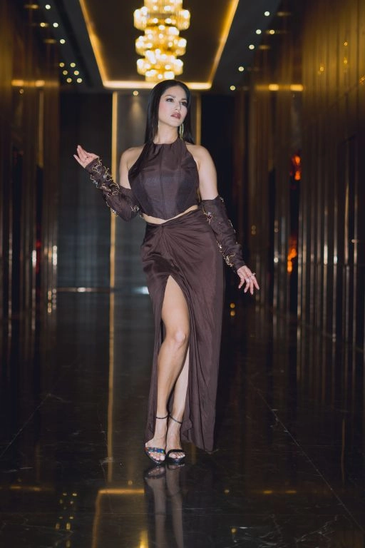 Sunny Leone in Nirmooha's Brown Corset Top with Hand Embroidered Bolero and Knotted Drape Skirt from Aham Asmi Collection.